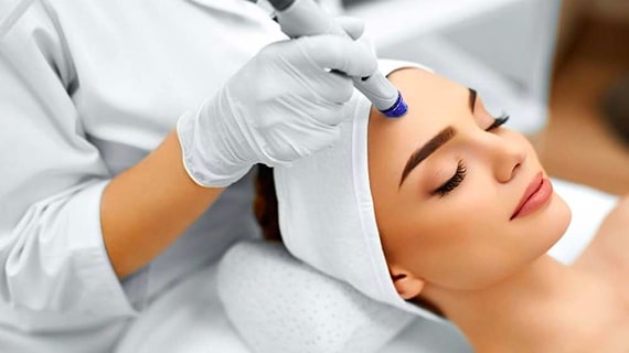 Woman Getting Hydro Microdermabrasion Treatment — Beautician in Coffs Harbour, NSW