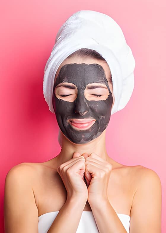 Woman With Charcoal Face Mask — Beautician in Coffs Harbour, NSW