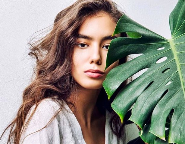 Beautiful Woman with Palm Leaf — Beautician in Coffs Harbour, NSW