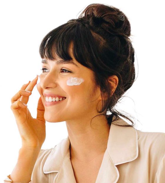 Woman Applying Face Cream — Beautician in Coffs Harbour, NSW